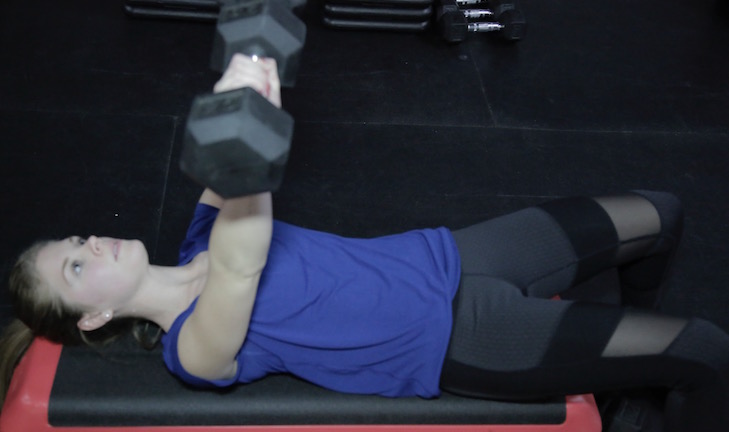 Woman using weights